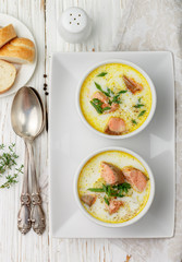 Creamy fish soup with salmon, potatoes, onions and carrots. Kalakeitto. Traditional dish of the Finnish cuisine