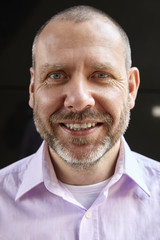 Close-up portrait of cheerful man