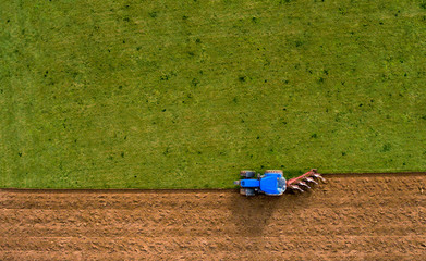 Tractor Ploughing Plowing Field - Aerial Shot