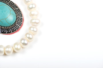 Pearl necklace and pendant on white background. Isolated.