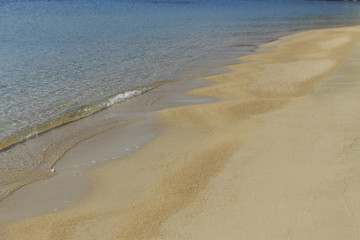 Soft sea wave on sandy beach, Beautifu colorful Greek beach with fine sand, Photo of sandy beach with soft wave in motion