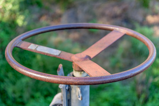 An old Iron wheel that opens a floodgate into a spillway on the Yarra River in Melbourne, Victoria, Australia