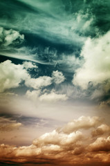 Obraz premium Fog and clouds looking up into a fantasy evening sky. Image looks antique, In red and blue colors