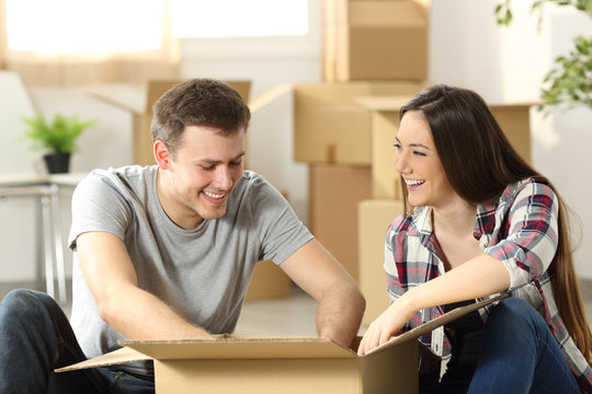 Couple moving home packing belongings