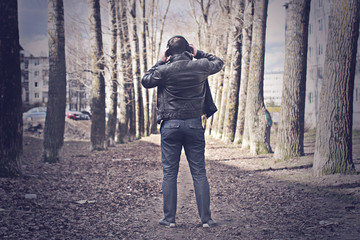 retro toned effected photo of alone man on street