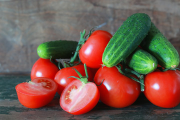 branch of tomatoes on wooden background