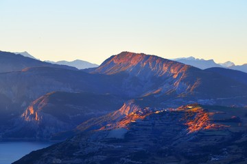 Panoramic view of lake Lac de serre-poncon in French Alps on a clear day