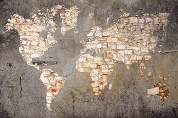 Stone world map on cracked wall background. Elements of this image furnished by NASA.