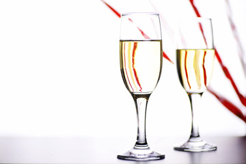 glass of white wine on a table on white background isolate