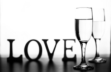 monochrome photo of champagne on white table on white background isolate