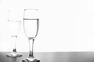 monochrome photo of champagne on white table on white background isolate