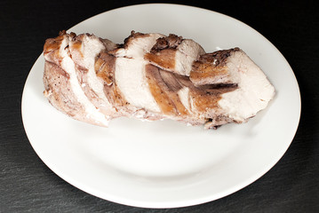 Chicken breast with fried crust on a white plate