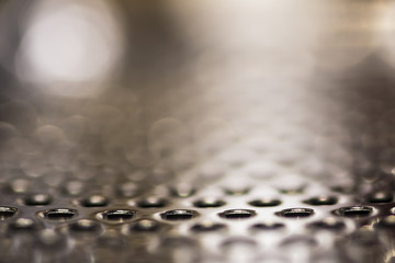 Round holes in a metal plate