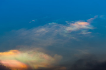 Color through clouds in the evening sky.