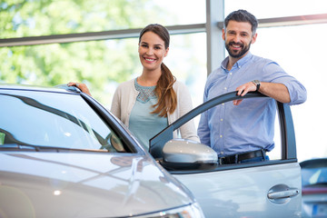 Young couple buying a car
