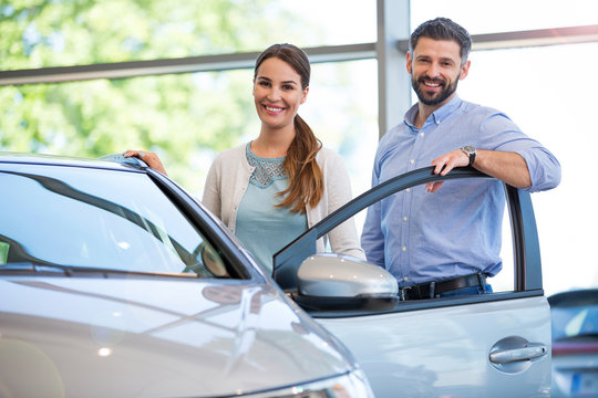 Young Couple Buying A Car
