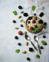 Healthy breakfast with oat flakes, raspberry berries, blueberries, selective focus