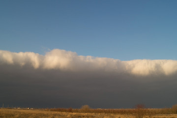 Dark cloud in the sky at sunset