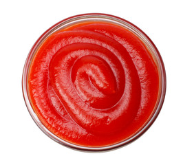 glass bowl of ketchup isolated on white background, top view