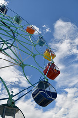 Ferris wheel in the summer Park.