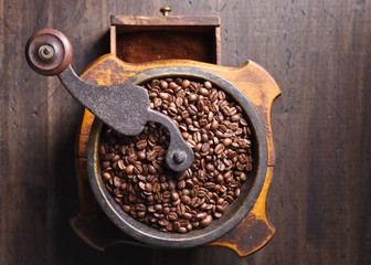close-up of old coffee grinder and roasted coffee beans