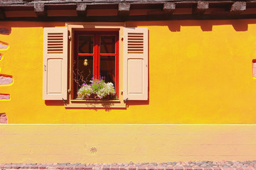 Picturesque facade with window in Hunawihr, Alsace, France