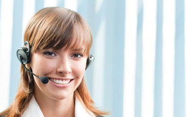 Cheerful smiling support phone operator at office