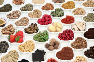 Aphrodisiac food for good sexual health with foods in heart shaped dishes over white background.