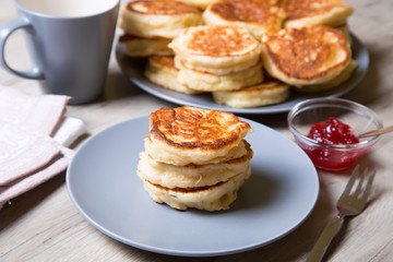 Fritters on kefir, yeast dough. Traditional Russian dish