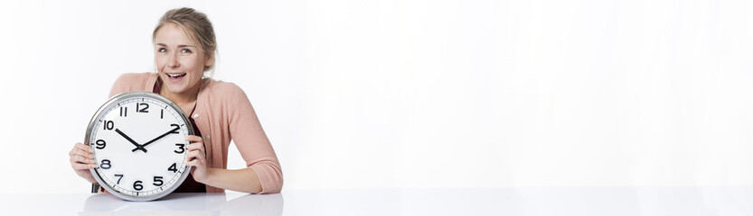 laughing beautiful young woman displaying a clock, long banner
