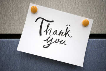 "thank you memo" hanging on the partition wall