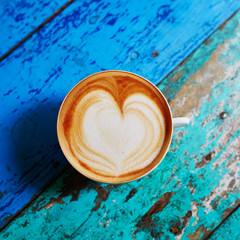 Coffee on blue wooden table, view from above, flat lay