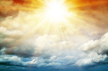 Abstract. Fog and clouds looking up into a fantasy multicolored sky. The bright red sun illuminates the whole picture.