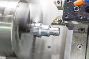 Plakat CNC lathe machine (Turning machine) cutting the aluminium screw thread shaft.Hi-precision CNC machining concept.