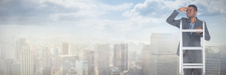 Composite image of businessman standing on ladder looking