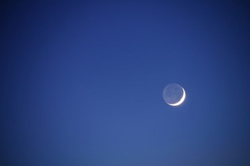 Moon in the night blue sky