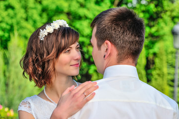 Young and handsome newlyweds on a walk in the park