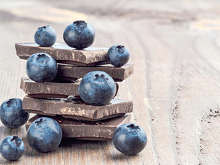 Stack of chocolate and blueberries with copy space