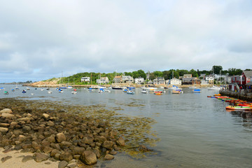 Fototapeta na wymiar Yachts in Rockport Harbor in downtown Rockport, Massachusetts, USA.