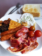 classical english breakfast with egg and fries