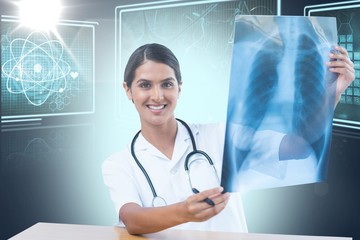Composite 3d image of female doctor examining chest x-ray