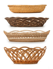 Set of wicker baskets, breadbaskets, bread-plates, dishes for food or fruits isolated on a white...