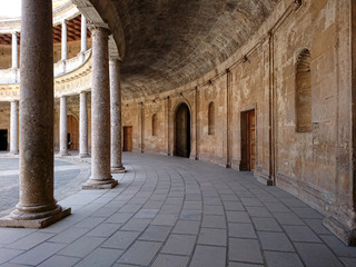 Obraz premium Inner corridors of courtyard of Palace of Charles V at Alhambra fortress in Granada,