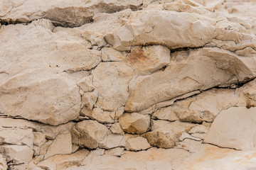 Background quarried rough textured limestone rock