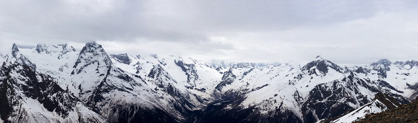 Fototapeta na wymiar Panorama of the Caucasus mountains. The Dombai mountain landscape