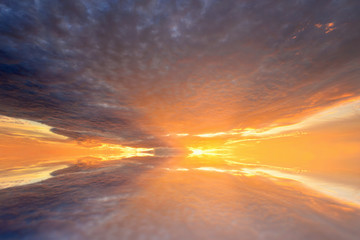 Fototapeta na wymiar Cumulus sunset clouds with sun setting down