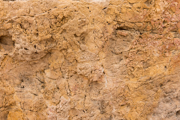Background quarried rough textured limestone rock
