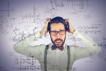 Composite image of frustrated man scratching head