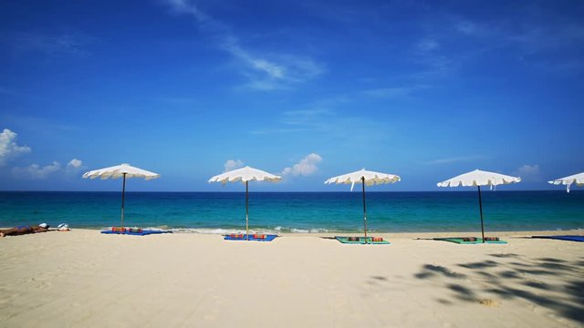 Tourist Sunbathing on Tropical Surin Beach, Phuket, Thailand