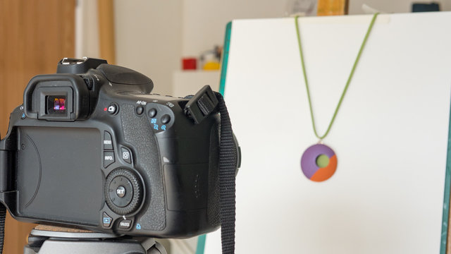 camera taking photographs of products in studio